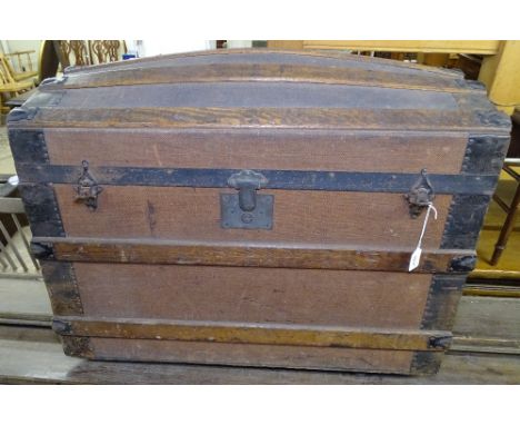 A 19th century steel and slat-bound dome-top trunk, W81cm 