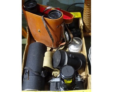 A Canon camera, lenses, and binoculars 