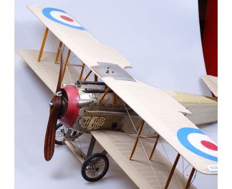 A Vintage biplane made from metal and plastic, wingspan 29" 