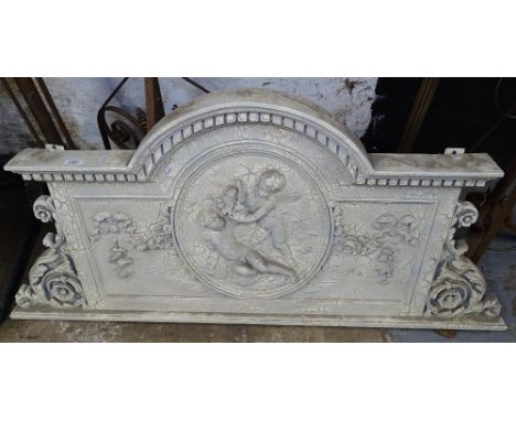A painted pine and composite panel pediment, with cherub decoration, L135cm, H63cm 