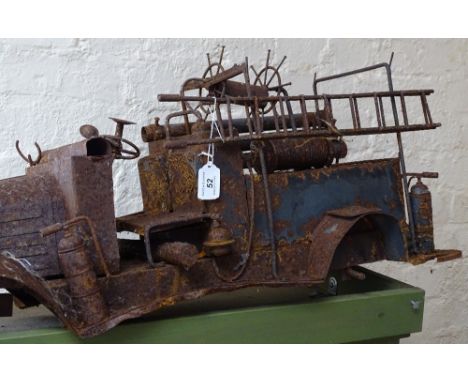A steel model of an early fire engine, length 29" 
