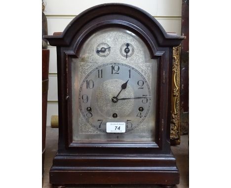 An Antique arch-top, 3-train mantel clock, height 14.5" 