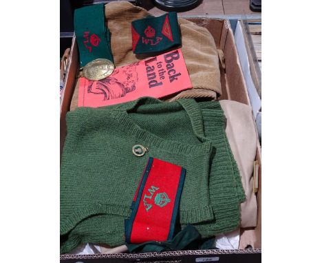 A Second World War Women's Land Army uniform, including arm bands 