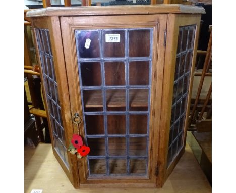 A pine and lead light glazed panelled hanging cabinet, of canted form, W63cm 