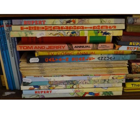 A shelf of Rupert and other children's books 