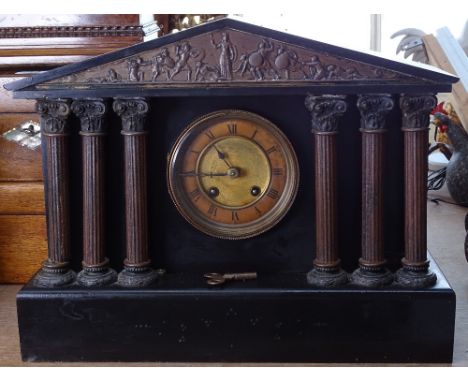 A black slate-cased mantel clock 