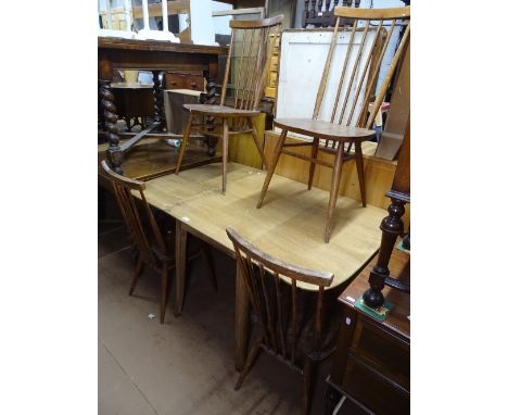 An Ercol drop leaf dining table, together with a set of 4 matching stick-back chairs 