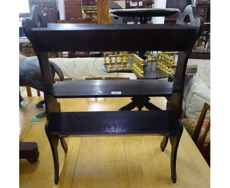 An Arts and Crafts oak 3-tier book trough, W55cm. 