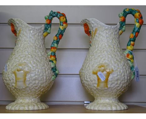 A pair of Clarice Cliff Harvest jugs, 10.5" 