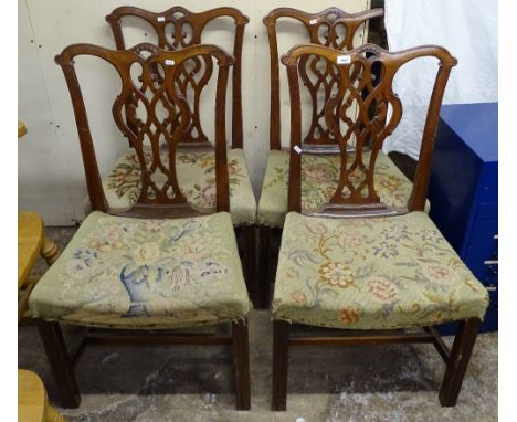 A set of 4 Chippendale design mahogany dining chairs, with wool work seats 