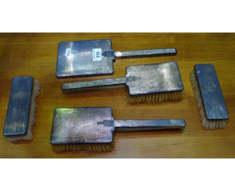 An Edward VIII engine turned silver-backed 5-piece brush and mirror set 