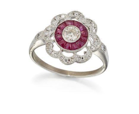 A RUBY AND DIAMOND CLUSTER RING, a round brilliant-cut diamond within a milgrain border of&nbsp;calibré-cut rubies and an out
