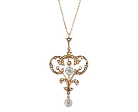 AN AQUAMARINE AND SEED PEARL PENDANT ON CHAIN, a round-cut aquamarine within a foliate scroll frame set throughout with seed 