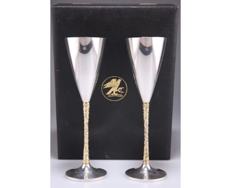 A PAIR OF ELIZABETH II PARCEL-GILT SILVER CHAMPAGNE FLUTES,&nbsp;by Stuart Devlin, London 1977, each with conical bowl and te