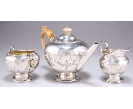 A VICTORIAN SILVER THREE-PIECE BACHELOR'S TEA SERVICE,&nbsp;by&nbsp;Henry Holland, London 1867, the teapot bullet-shaped, wit