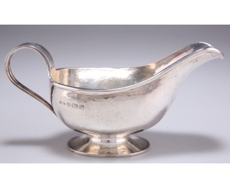 A GEORGE VI SILVER SAUCE BOAT,&nbsp;by&nbsp;Albert Edward Jones, Birmingham 1937, with spot-hammered ground and tapering stra