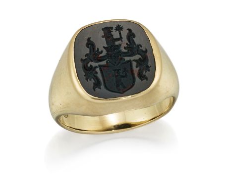 A BLOODSTONE INTAGLIO SIGNET RING, a cushion-cut bloodstone engraved with a crest, to a tapering shank. Ring size Q1/2, 10.5 