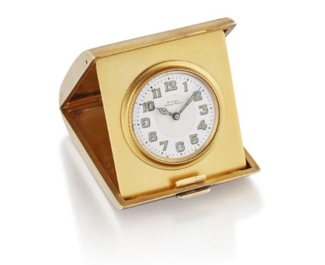 A SILVER-GILT FOLDING TRAVEL ALARM CLOCK. Circular white enamel dial 32mm diameter with luminous hands and arabic index, set 