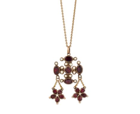 A GARNET AND SEED PEARL PENDANT / BROOCH ON CHAIN, a cross motif set with square and oval-cut garnets and seed pearls in clos