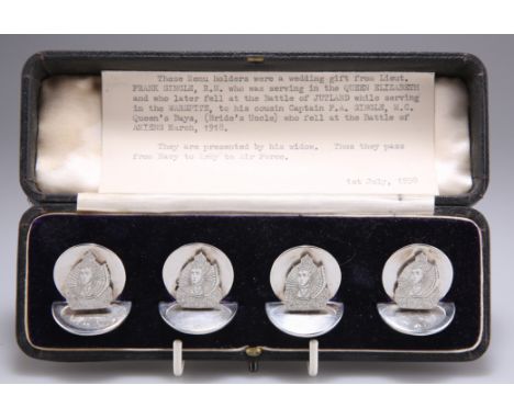 A CASED SET OF FOUR GEORGE V SILVER MENU HOLDERS, by Sampson Mordan & Co, London 1915, with circular bases and backs, each ap