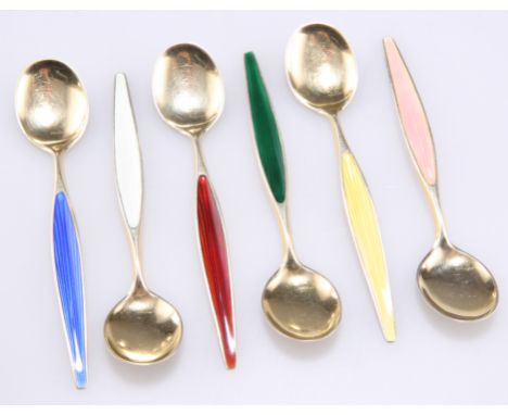 A SET OF SIX NORWEGIAN SILVER GILT HARLEQUIN ENAMEL COFFEE SPOONS, by Otta Hval, the stems each in an assorted colour colour 