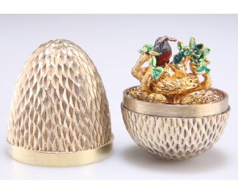 AN ELIZABETH II SILVER-GILT SURPRISE EGG,&nbsp;by Stuart Devlin, London 1976,&nbsp;no.74, the textured body opening to reveal