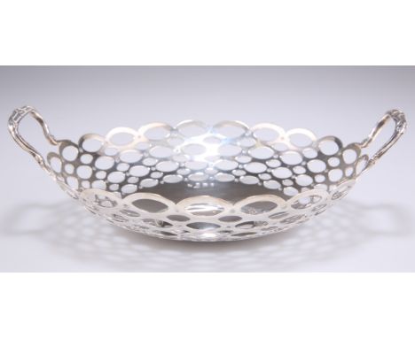 AN EDWARD VII SILVER TWO-HANDLED BON BON DISH, by A &amp; J Zimmerman, Birmingham 1908, of circular from with a domed centre,