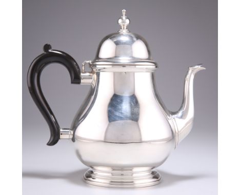 A SUBSTANTIAL AMERICAN SILVER TEAPOT, by Tiffany &amp; Co, of squat pear shape, the domed hinged cover with vase-form finial,