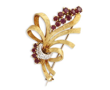 AN 18 CARAT GOLD RUBY AND DIAMOND BROOCH, a textured ribbon tied by round-cut rubies and eight-cut diamonds. Hallmarked Londo