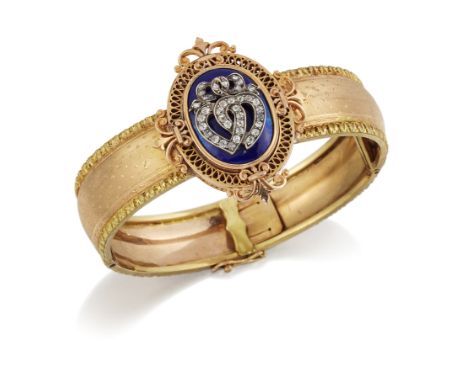 AN ENAMEL AND DIAMOND BANGLE, a diamond set twin hearts motif to a blue guilloche enamel ground and within a fancy oval frame