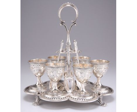 A VICTORIAN SILVER EGG CRUET, by Barnard & Sons Ltd, London 1872, with six egg cups, raised scroll form handle, all with pier