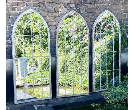 ARCHITECTURAL GARDEN WALL MIRRORS, set of three, 160cm high, 67cm wide, arched aged metal frames. 