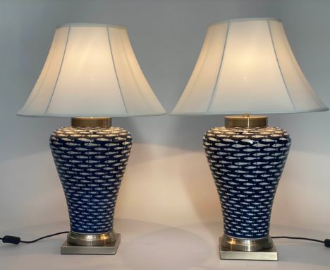 FISH TABLE LAMPS, a pair, ceramic white on blue ground tapering vase form and metal base with shade, 75cm H. (2) 