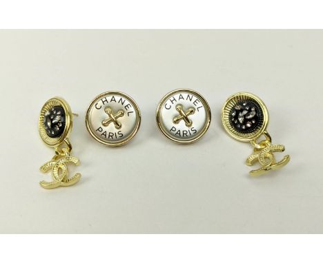 CHANEL EARRINGS, a pair of stud earrings with the 'Chanel Paris' inscription on mother-of-pearl effect ground, gilt metal sur