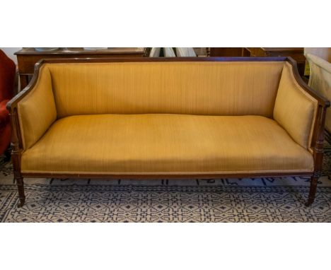 SOFA, 75cm H x 173cm W x 75cm D, late Victorian mahogany, circa 1890, in light brown fabric on brass castors. 