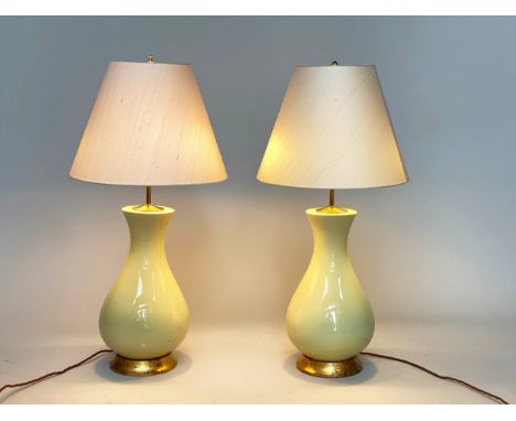 TABLE LAMPS, a pair, by Heathfield and Co., pale yellow Louisa glazed ceramic vase form with giltwood bases and silk shades, 