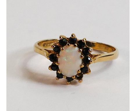 9ct gold ladies dress ring, set with opal and black stones, size N, 1.9g. 