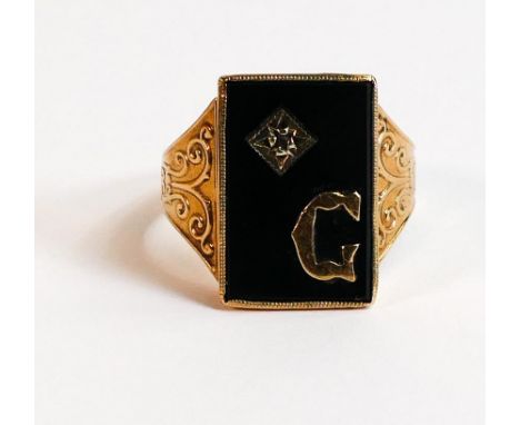 Gentleman's 9ct gold ring set with black onyx stone initialled G,size T,5.4g. 