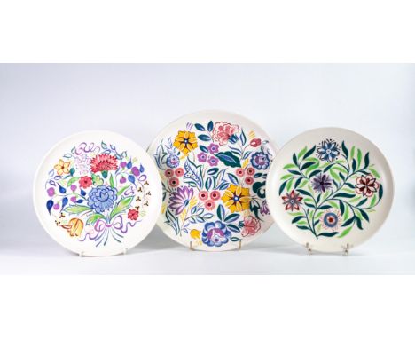 Poole pottery large floral wall charger together with two small wall plates. Diameter of largest 31.5cm (3) 