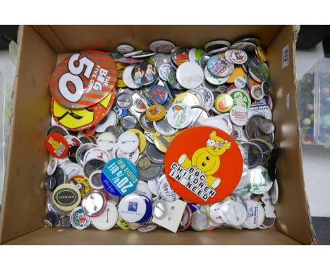 A collection of vintage tin motto badges 