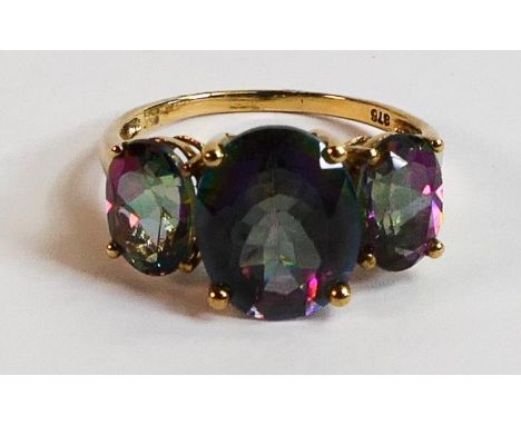 9ct gold ladies dress ring, set with three purple stones, size O, 3.3g. 