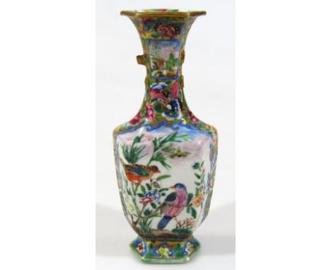 A 19thC Japanese porcelain vase, polychrome decorated with birds and branches on a shaped foot predominantly in blue, green a