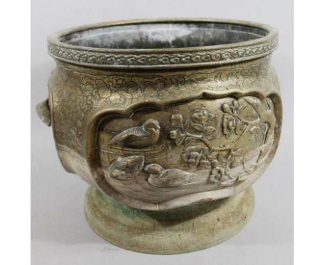 A 19thC Japanese metal jardiniere, of circular outline, profusely decorated with flowers with an upper floral geometric patte