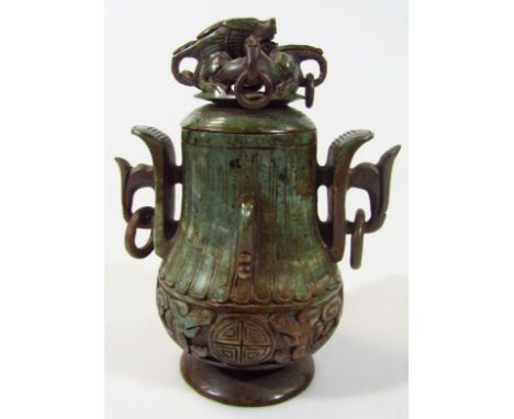 A 20thC decorative metal censer, the pear shaped body with a cast decorative lower banding, set with orbs and stylised scroll