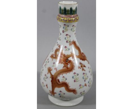 A Chinese porcelain sake bottle, the bulbous body polychrome decorated with dragons in geometric pattern, with an upper flora