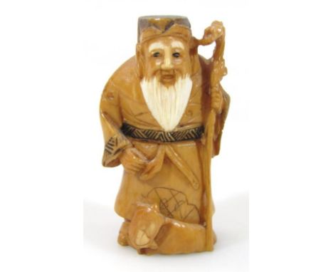 A Japanese netsuke, formed as a bearded sage holding staff, with animals to the base, two character mark beneath, 6cm high, l