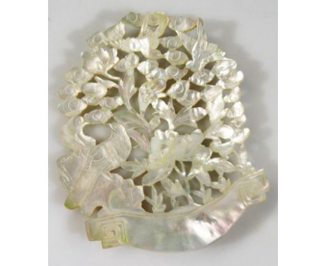 A 19thC pierced mother-of-pearl nacre style panel, formed as birds, flowers and trees, 14cm high.
