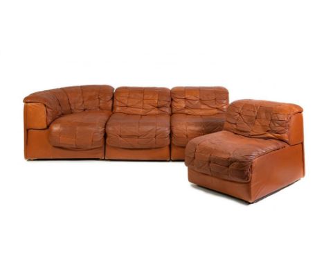Modular sofa set.  Model DS11, 70s.Upholstered in brown leather,Measurements: 65 x 265 x 90 cmSet of loose armchairs forming 