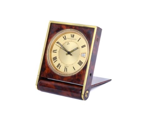A vintage Jaeger-Le-Coultre travelling timepiece for Hermes. With black Roman numerals and date aperture, the back numbered 1