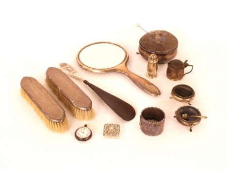 A silver mounted pin cushion; a pair of silver back hair brushes and hand mirror; small silver fob watch; pill box etc.